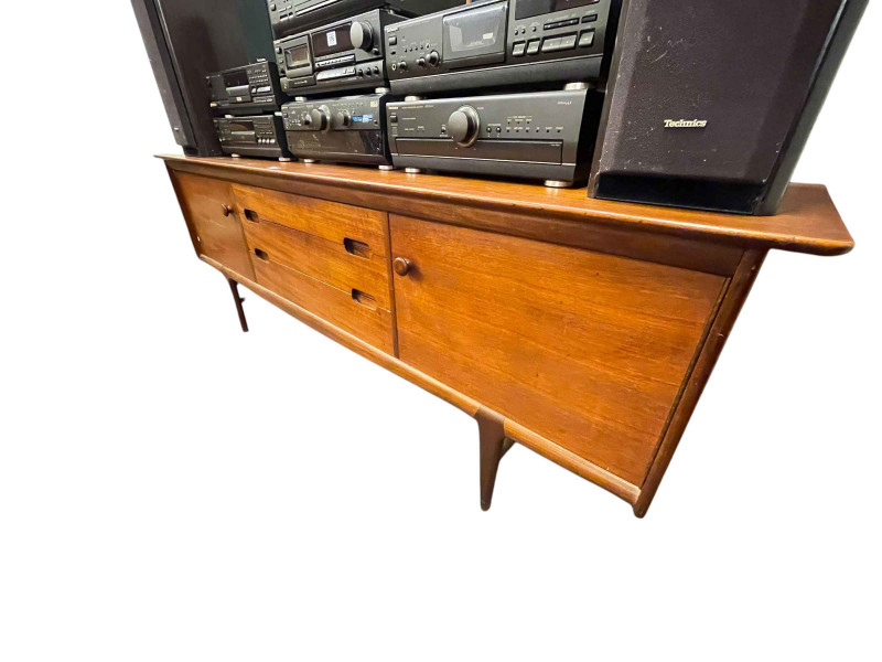 A Younger Ltd mid Century teak long john sideboard, circular teak glazed top coffee table nest of tables and teak glazed top coffee table (3).