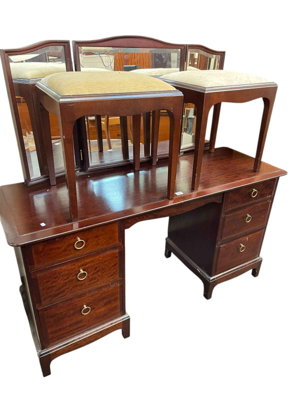 Stag Minstrel six drawer triple mirror dressing table and two dressing stools.