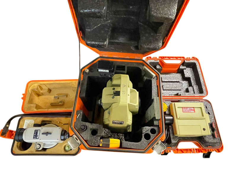 Three cased surveying instruments including two Leica.
