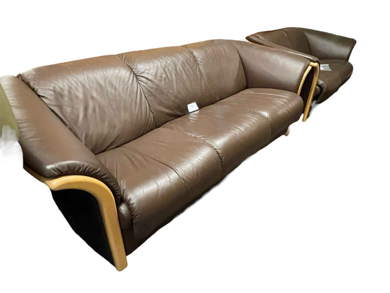 Pair Ekornes Manhattan three seater and two seater settees in chocolate brown leather.