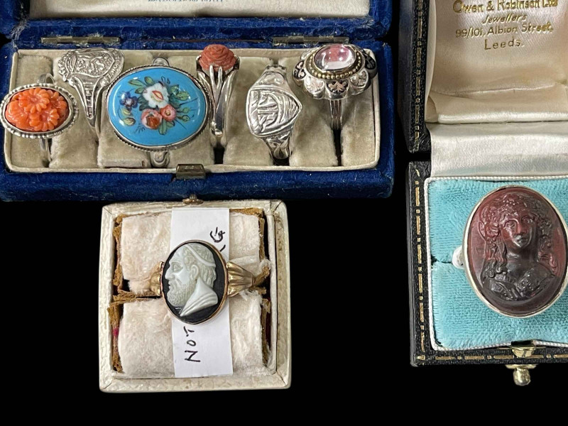 Six silver rings, two with coral and two cameo rings (8).