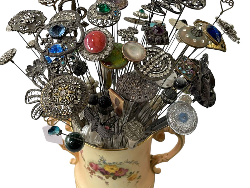 Royal Worcester blush ware loving cup with large collection of over 80 hat pins.