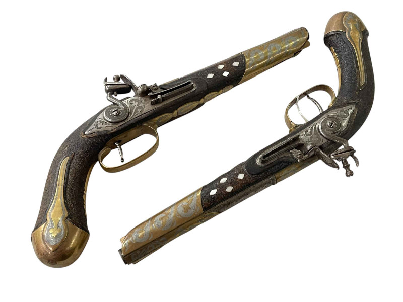 Pair replica ornate pistols.