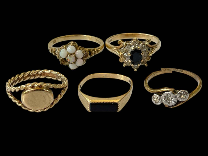 Five 9ct gold rings.