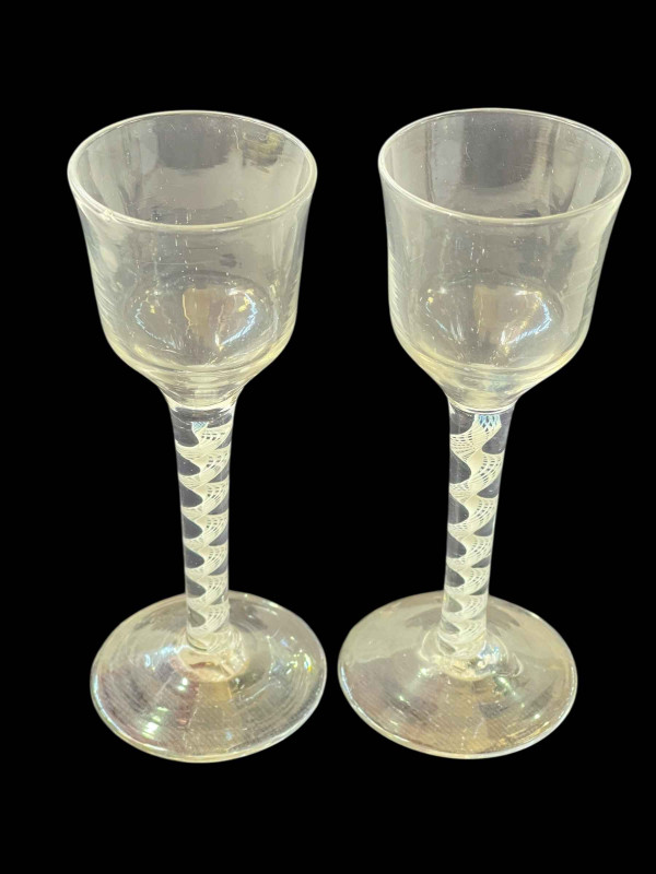 Two antique cotton twist stem glasses.