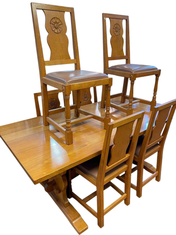 Coxwold cabinet makers unicorn mahogany oak refectory dining table, 75cm x 90cm x 183cm, together with a set of six Yorkshire Rose carved panel back dining chairs.