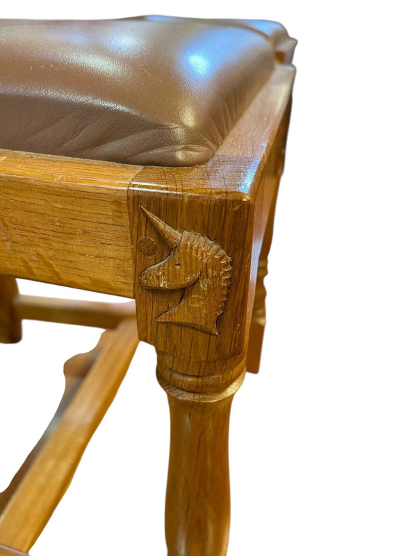Coxwold cabinet makers unicorn mahogany oak refectory dining table, 75cm x 90cm x 183cm, together with a set of six Yorkshire Rose carved panel back dining chairs.