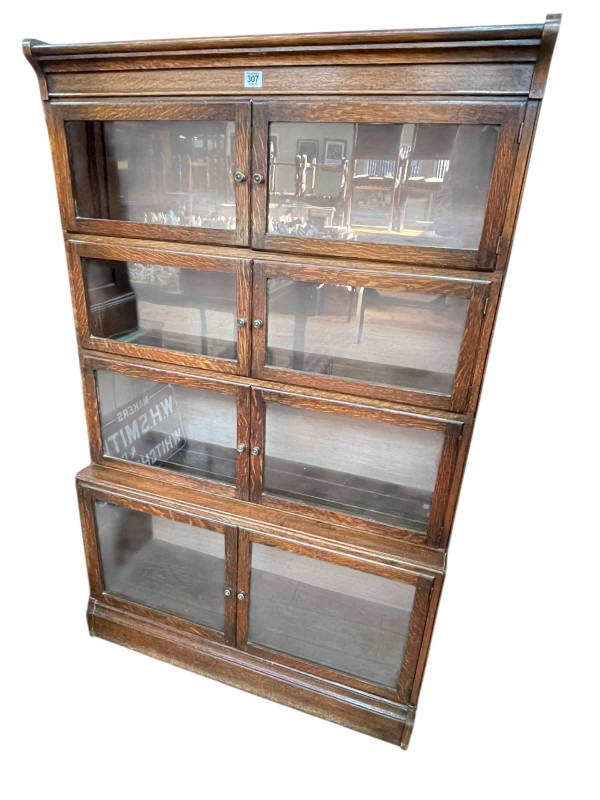 Early 20th Century oak four height bookcase having eight glazed panel doors, 141cm x 89cm x 31cm.