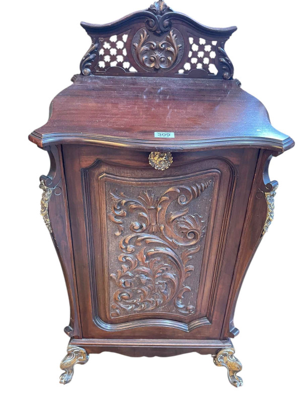 Late 19th Century carved mahogany coal purdonium on brass claw legs, 83cm x 44cm x 42cm.