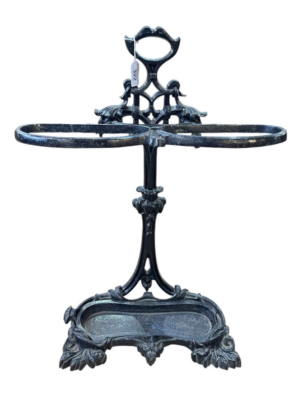 Cast iron two division stick stand, 71cm x 50cm x 17cm.