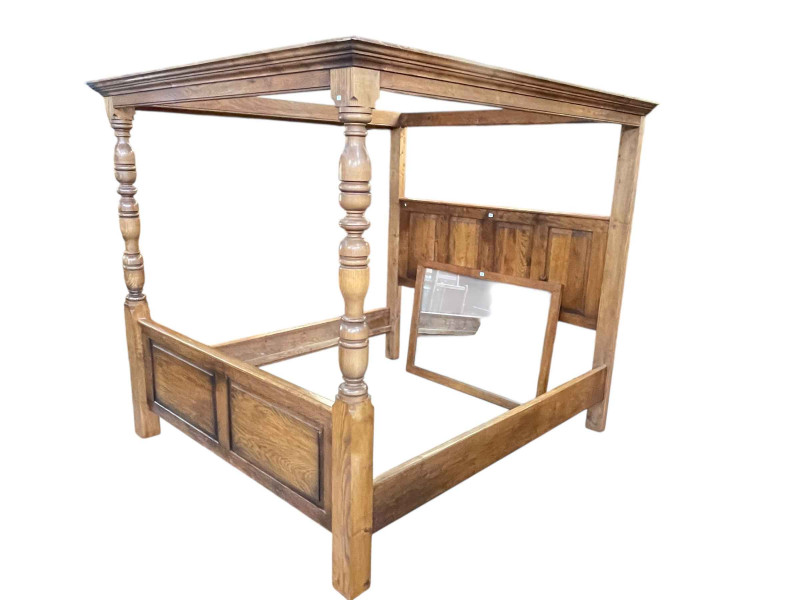 Panelled oak four poster having turned pillars, 199cm x 207cm x 223cm.