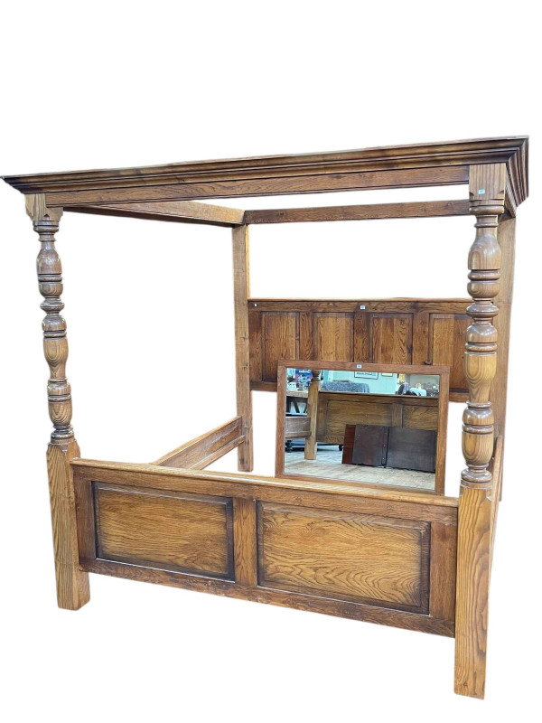 Panelled oak four poster having turned pillars, 199cm x 207cm x 223cm.