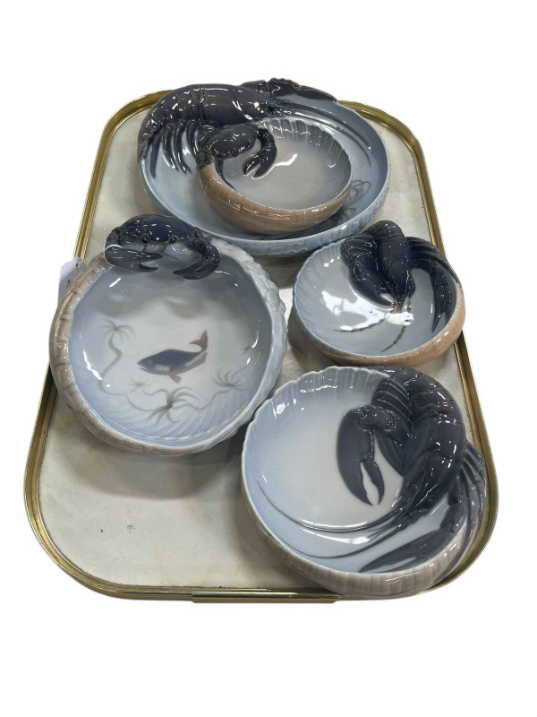 Five Royal Copenhagen lobster and crab dishes.