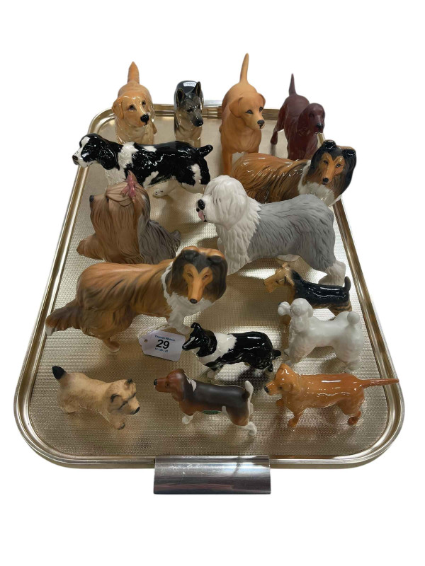 Collection of fifteen Beswick dogs.