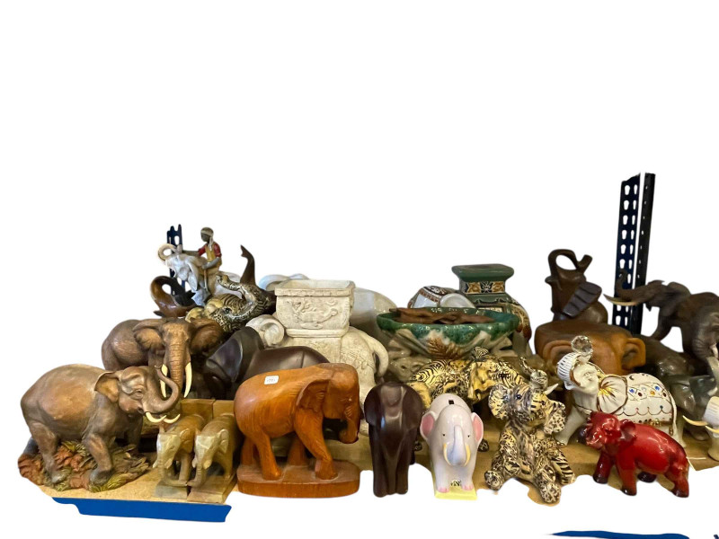 Large collection of elephants including Capo di Monte, Ann Richmond, Beswick, Royal Dux, coffee table, wooden sculptures, etc.