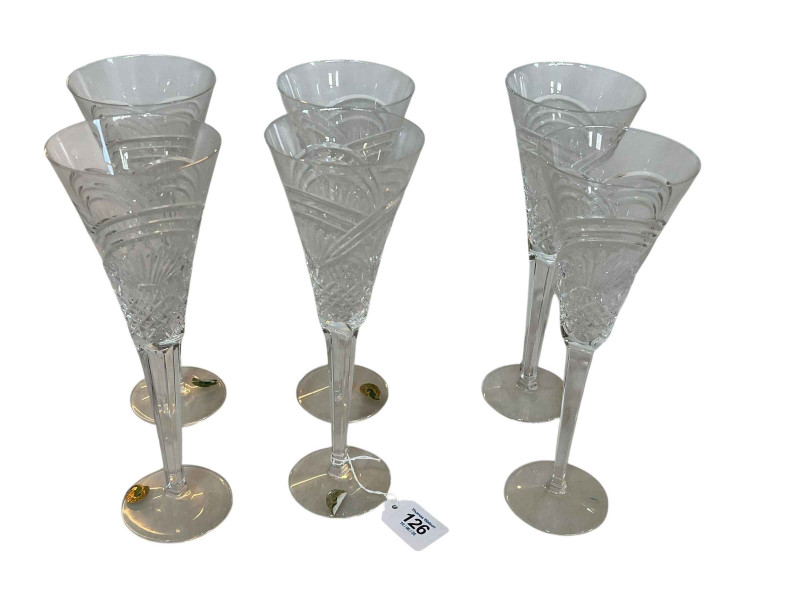 Six Waterford Millennium champagne flutes.
