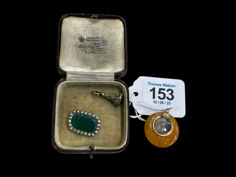 Amber colour agate pendant with painted eye and lips locket, turquoise fob, and seed pearl and green stone pendant (3).