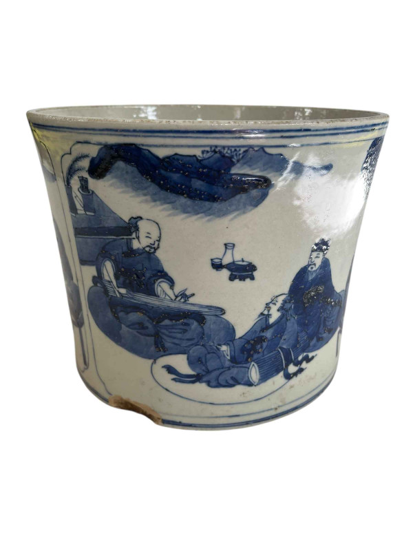 Large Chinese blue and white brush pot with two panels of figure decoration.