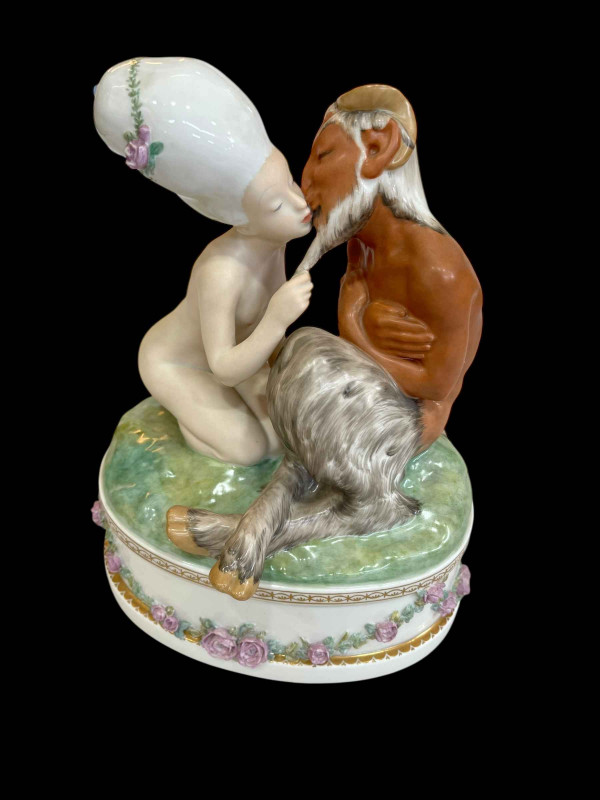Royal Copenhagen Group 'Faun & Nymph' designed by Gerhard Henning with decorative base featuring applied flowers, No 1119, 27cm.