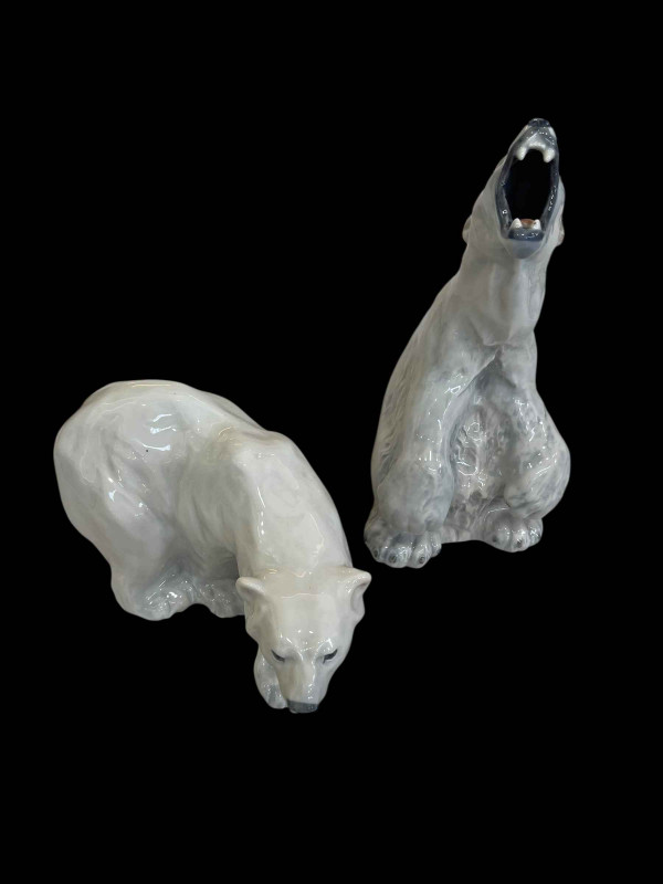 Royal Copenhagen figurine of a Polar Bear Walking, model No 1137, and a Polar Bear Rearing Up designed by Peter Herold, model No 060, 33cm.