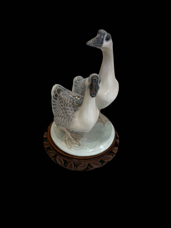 Royal Copenhagen figurine of a pair of Chinese Geese designed by Peter Herold, model No 2048 on wood stand.