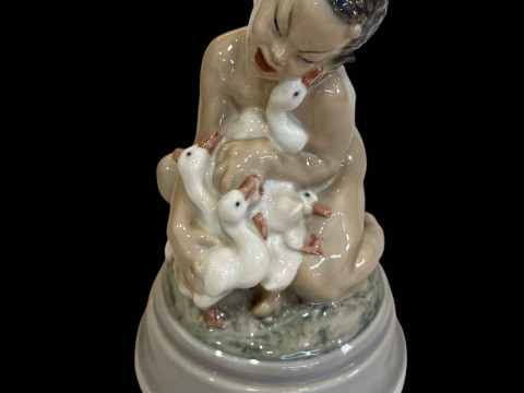 Royal Copenhagen Dahl Jensen figurine of a Faun Holding a Group of Ducklings,...