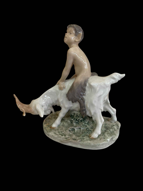 Royal Copenhagen figurine of a Faun Riding a Goat, model No 737.