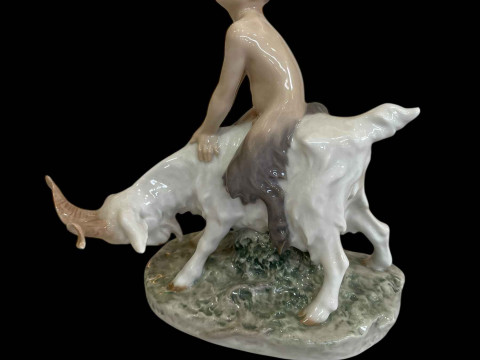 Royal Copenhagen figurine of a Faun Riding a Goat, model No 737.