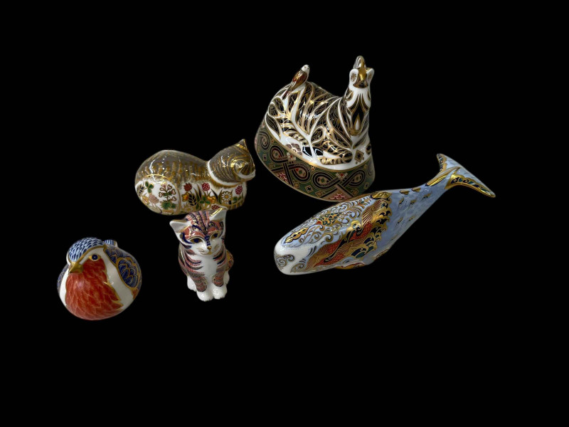 Five Royal Crown Derby paperweights including Zebra, Whale, Robin and Cats.