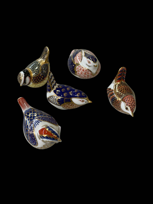 Five Royal Crown Derby bird paperweights.