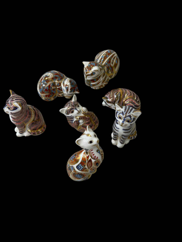 Seven Royal Crown Derby Cat and Kitten paperweights.
