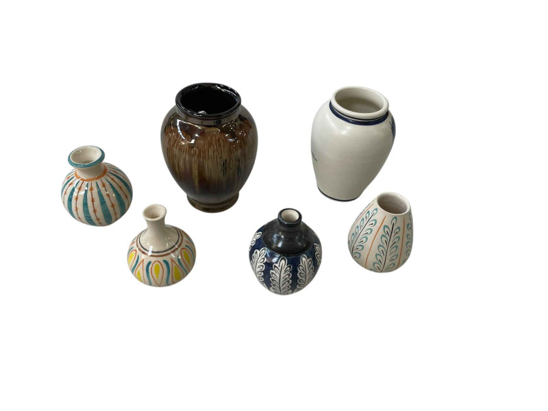 Six Poole vases.
