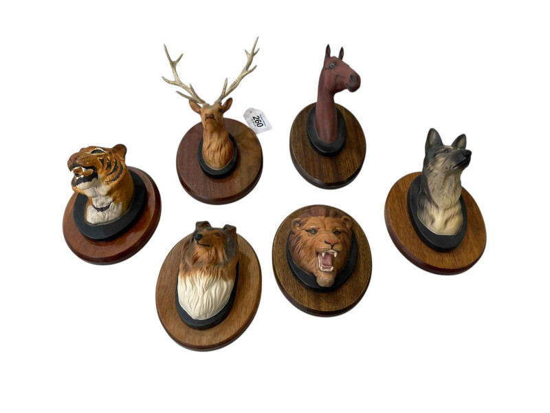 Six Beswick mounted animal face plaques.