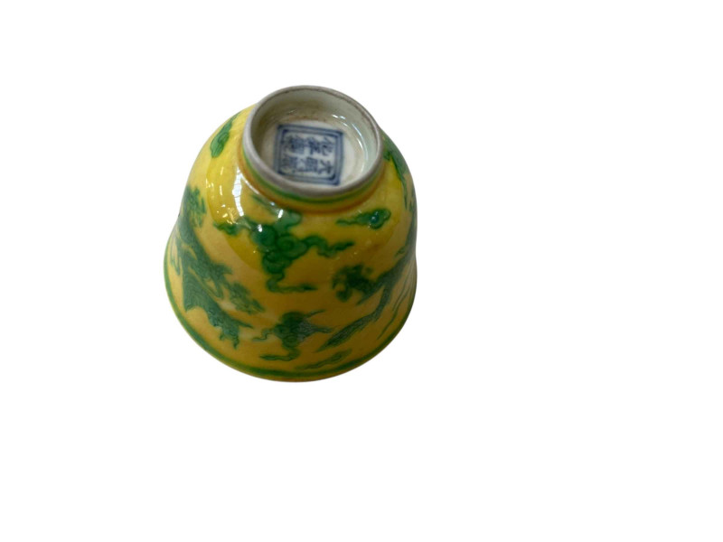Chinese tea bowl with green dragon on yellow ground, blue six character mark.