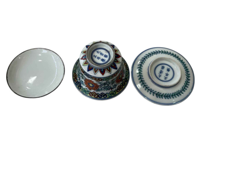 Chinese porcelain tea bowl, cover and stand with foliate design, blue six character mark.