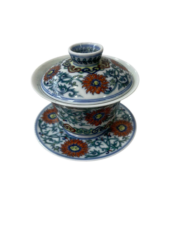 Chinese porcelain tea bowl, cover and stand with foliate design, blue six character mark.