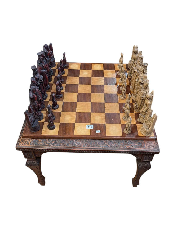 Carved hardwood chess table, resin chess set and chess board.