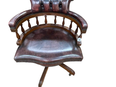 Cherry deep buttoned leather and studded Captains style swivel desk chair.