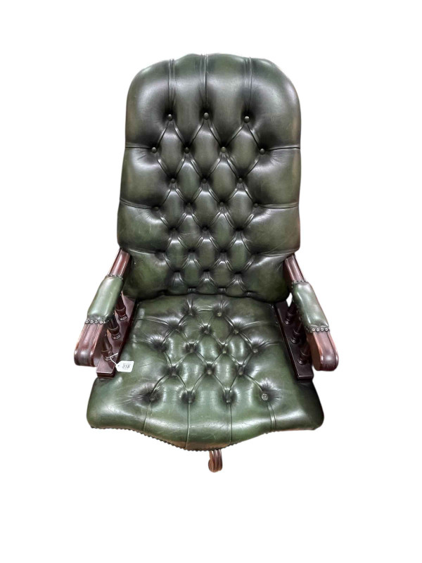 Green deep buttoned leather and studded swivel desk chair.