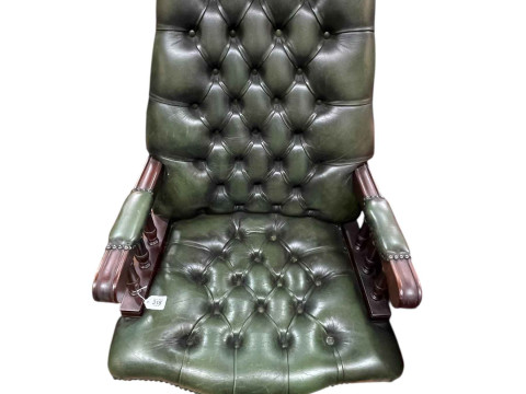 Green deep buttoned leather and studded swivel desk chair.