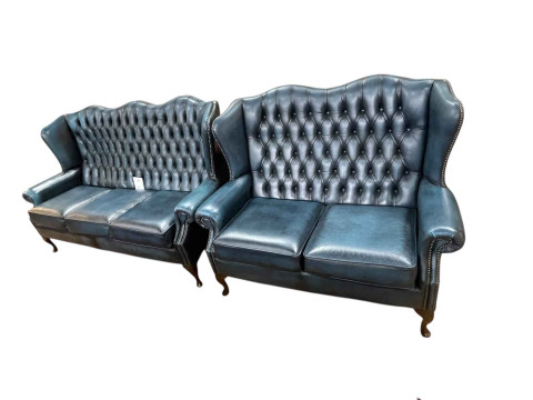 Pair blue deep buttoned leather wing backed three seater and two seater...