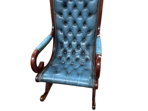 Blue deep buttoned leather scroll arm rocking chair.