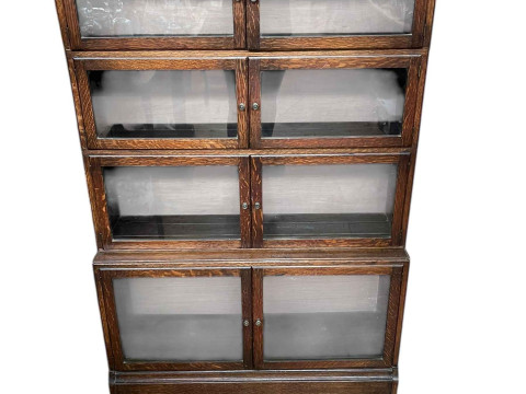 Early 20th Century oak four height bookcase having eight glazed panel...