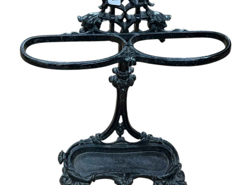 Cast iron two division stick stand, 71cm by 50cm by 17cm.