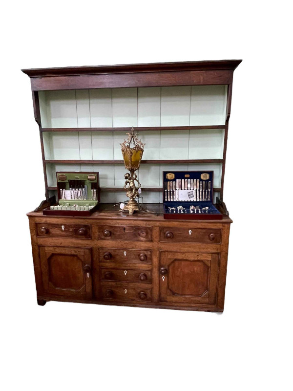 Antique oak dresser and rack, the three tier open rack above a base of three drawers, three central faux drawers and two cupboard doors, 208cm by 178cm by 50cm.