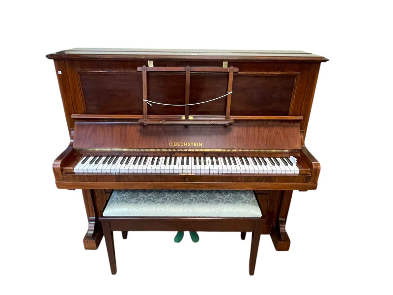 C Bechstein upright piano stamped V 27244 and WL 31715, 127cm by 147cm by 60cm together with a duet stool and contents.