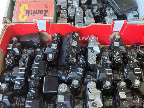 Box of Zenit and box of assorted cameras, various lenses, etc.
