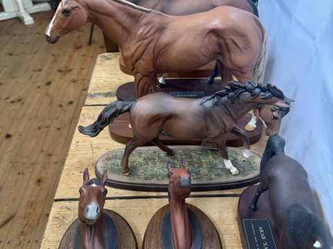 Four Beswick horses including Troy, Grundy, Racehorse and Arab Xayal,...