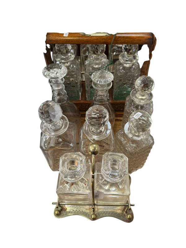 Two three bottle tantalus, two bottle tantalus and six decanters.