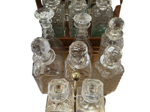 Two three bottle tantalus, two bottle tantalus and six decanters.